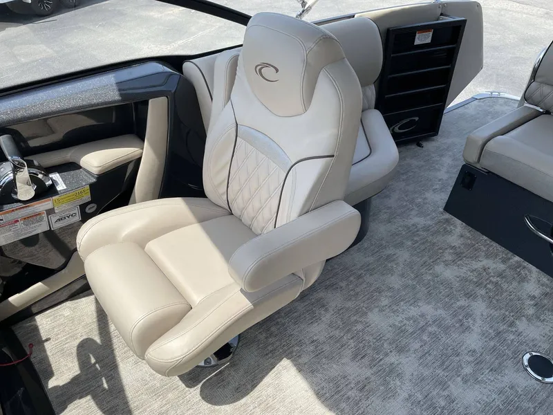 Slide: The Image of Interior of 2021 Crest 270 Continental featuring luxurious captain's chair. - 39