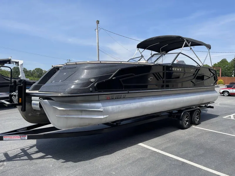 Slide: The Image of 2021 Crest 270 Continental pontoon boat on trailer outdoors. - 4