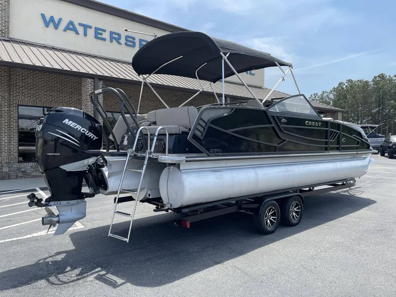 Slide: The Image of 2021 Crest 270 Continental pontoon boat with Mercury engine on trailer. - 6