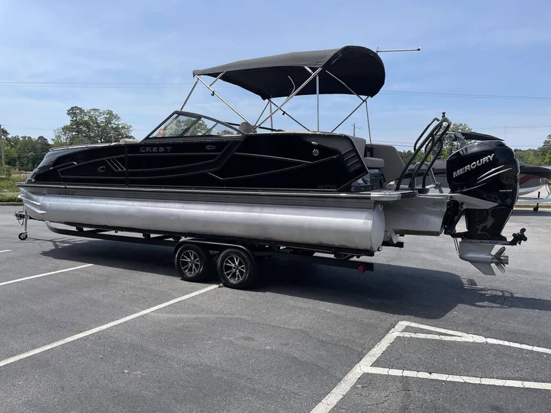 Slide: The Image of Black 2021 Crest 270 Continental pontoon boat on trailer. - 8