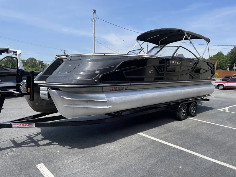 Slide: The Image of 2021 Crest 270 Continental pontoon boat on trailer outdoors. - 9