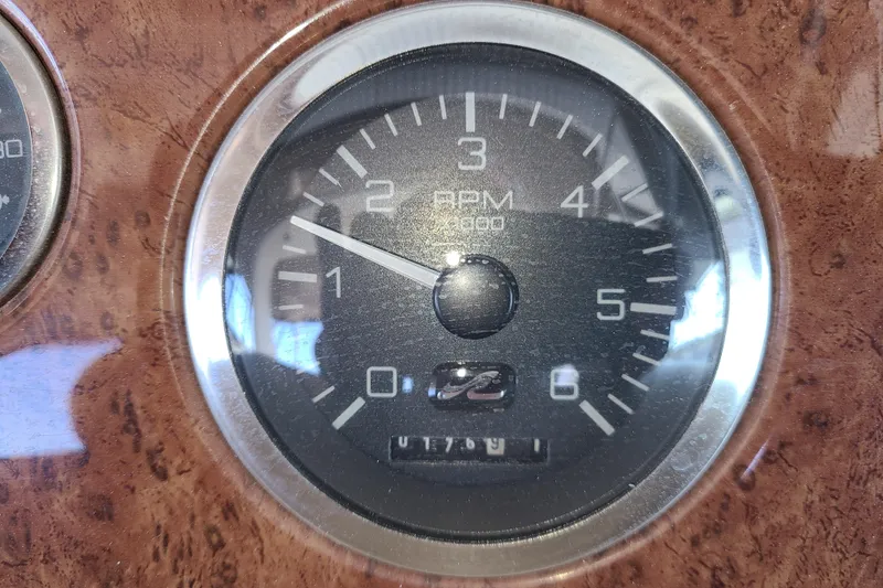 Slide: The Image of Tachometer of 1999 Sea Ray Sundancer 310 boat, displaying RPM gauge. - 15