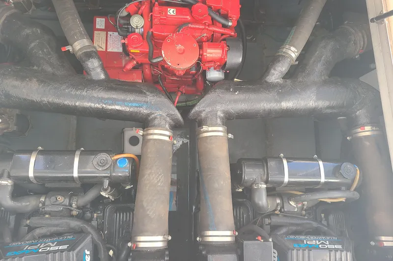 Slide: The Image of Engine compartment of a 1999 Sea Ray Sundancer 310 boat, showcasing dual engines. - 20