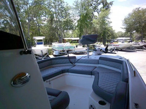 Slide: The Image of Interior view of 2024 NauticStar 211 Hybrid boat with gray seating. - 7