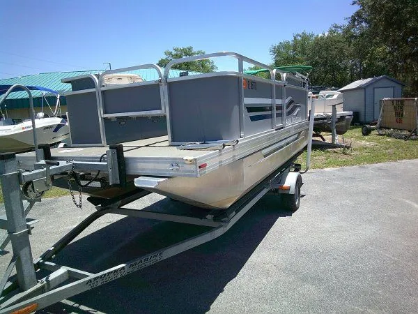 Slide: The Image of PlayCraft Laker 14' Minitoon 2022 on trailer outdoors. - 4