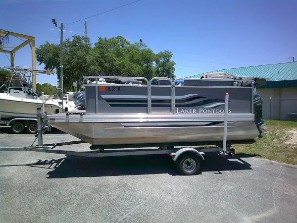 Slide: The Image of 2022 PlayCraft Laker 14' Minitoon pontoon boat on trailer. - 5