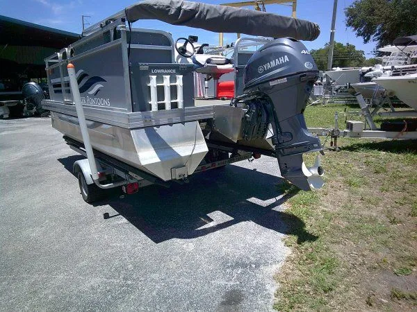 Slide: The Image of PlayCraft Laker 14' Minitoon 2022 with Yamaha motor on trailer. - 6