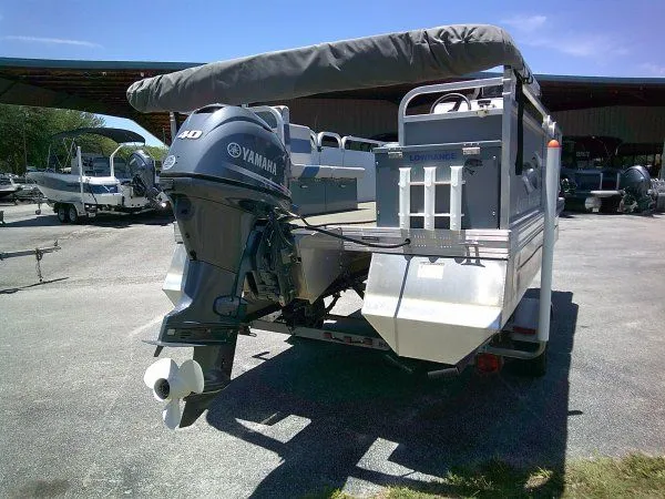Slide: The Image of 2022 PlayCraft Laker 14' Minitoon with Yamaha motor outdoors. - 8