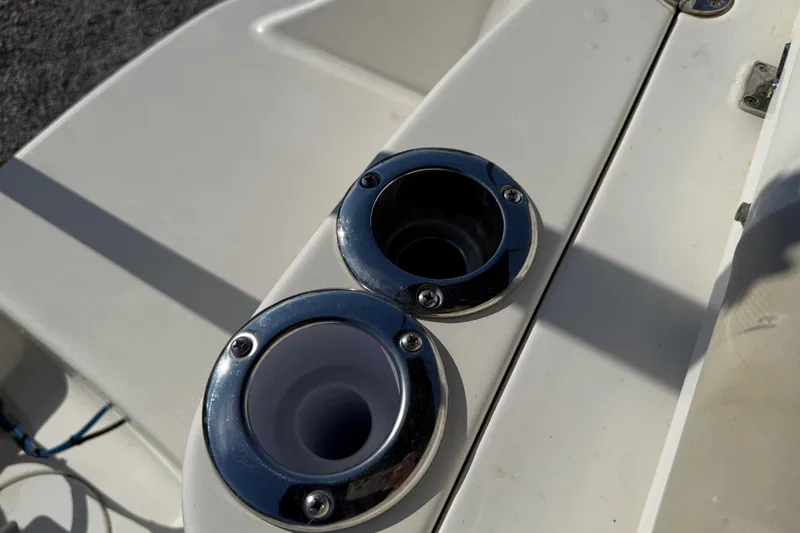 Slide: The Image of 2015 Robalo R227 Dual Console boat cup holders with chrome finish. - 33