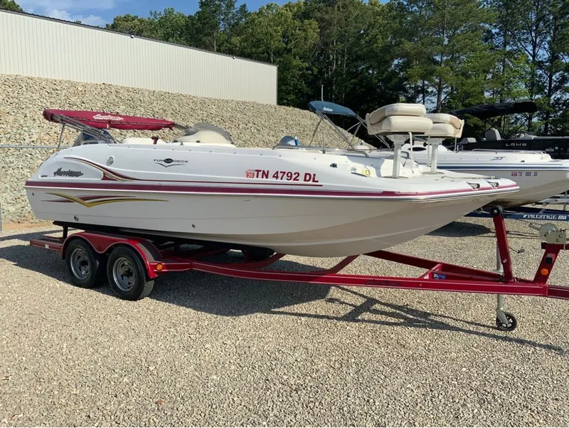 The Image of 2005 Hurricane GS202 boat on red trailer outdoors. - 1