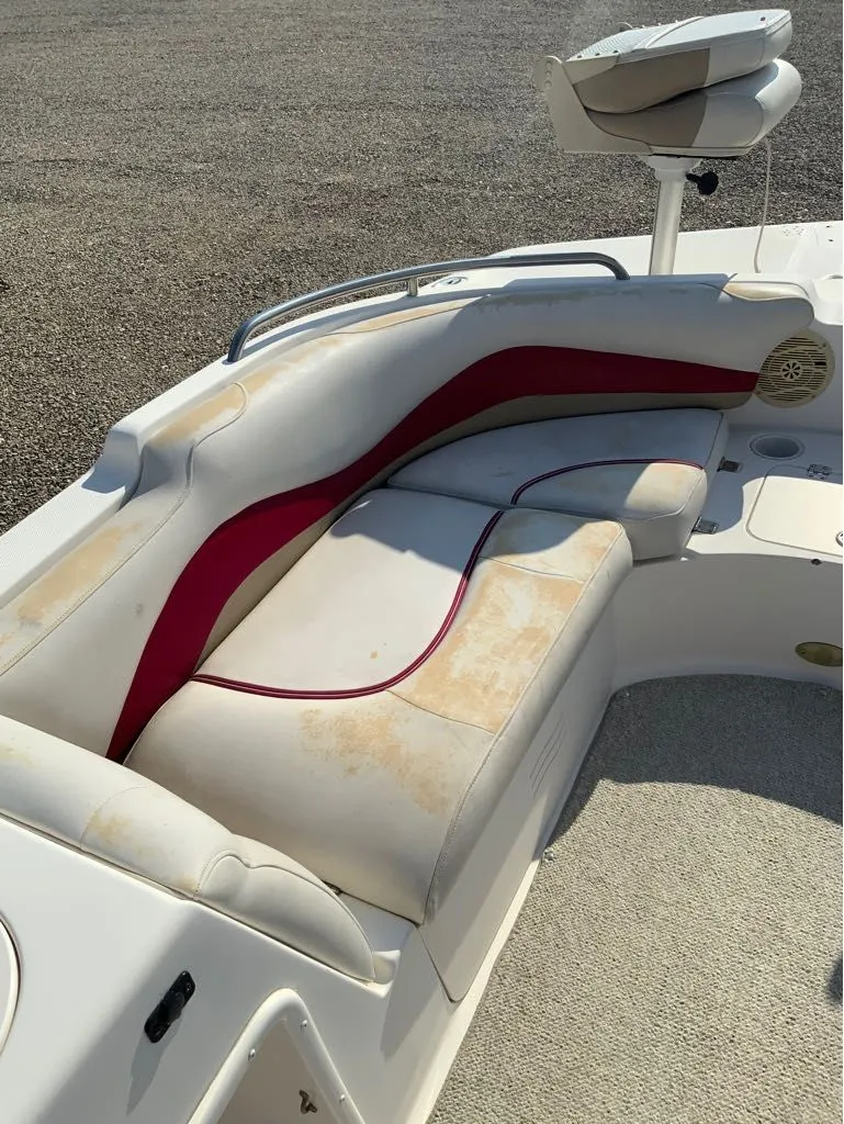 Slide: The Image of Hurricane GS202 boat seating, 2005, with worn white and red upholstery. - 10