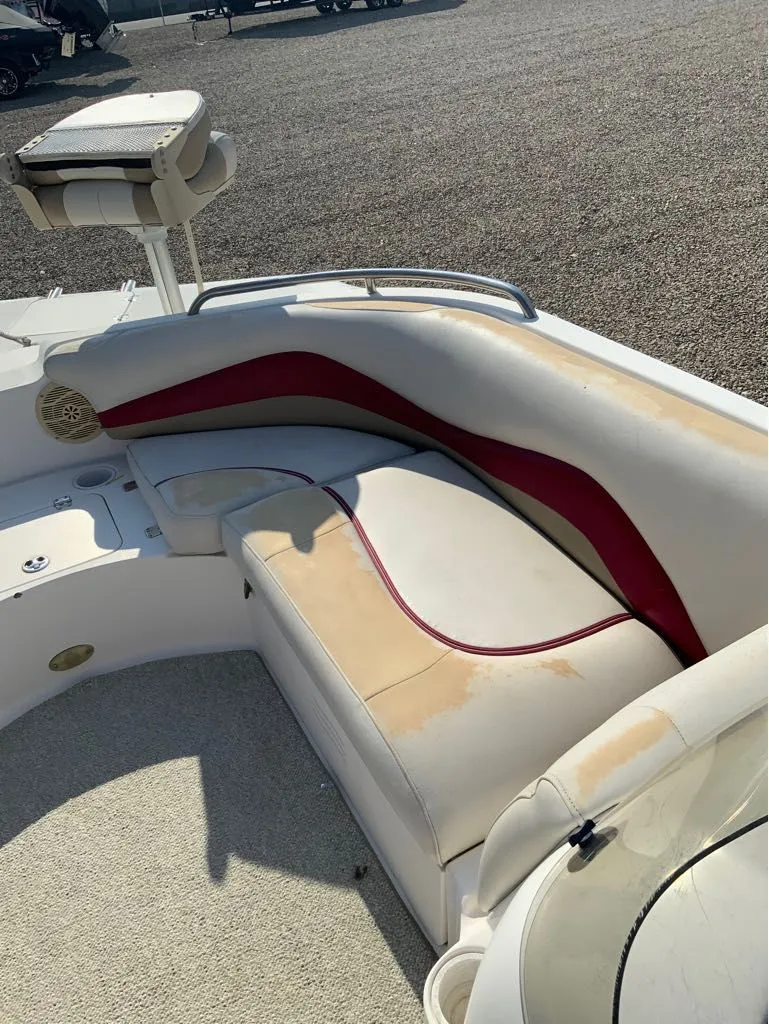 Slide: The Image of 2005 Hurricane GS202 boat with worn seats and red accent. - 3