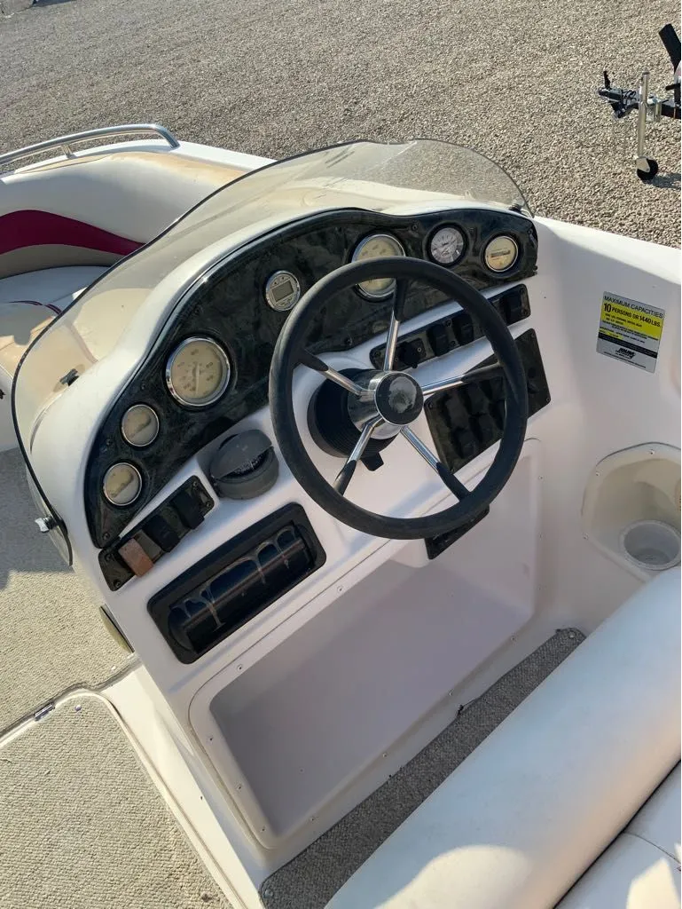 Slide: The Image of 2005 Hurricane GS202 boat steering console with instruments. - 5