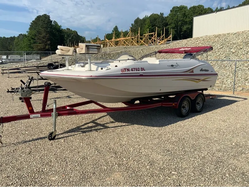 Slide: The Image of 2005 Hurricane GS202 boat parked on trailer outdoors. - 6