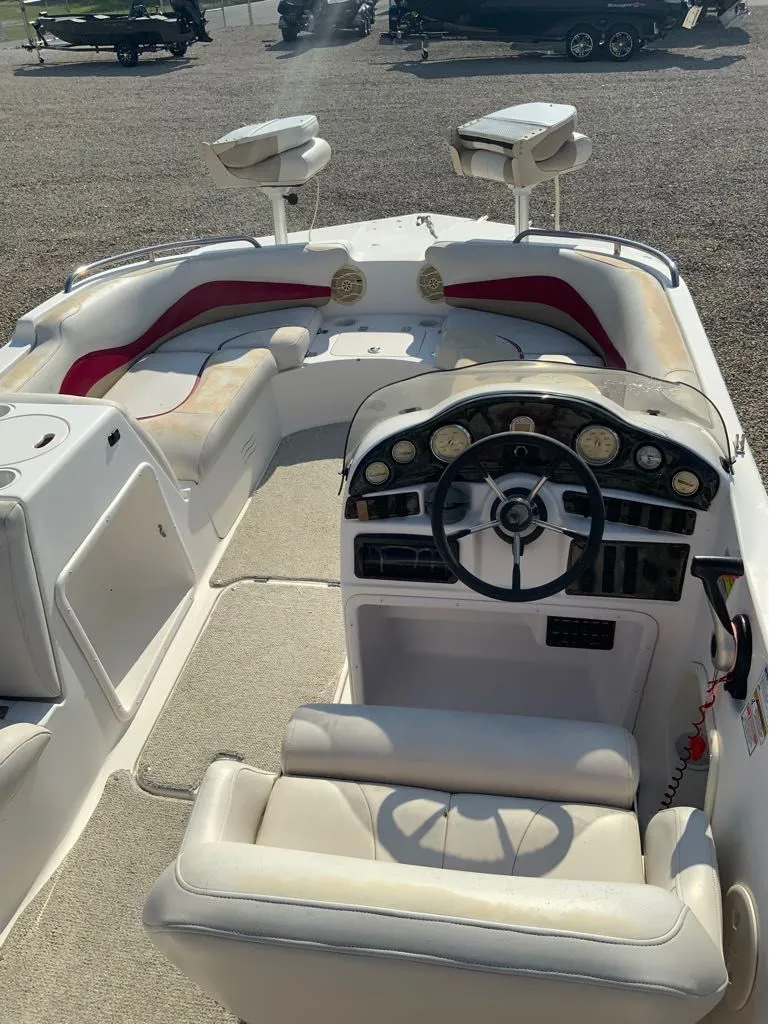 Slide: The Image of Interior of a 2005 Hurricane GS202 boat with steering console. - 7