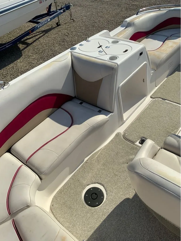 Slide: The Image of Interior of a 2005 Hurricane GS202 boat with white seating. - 8