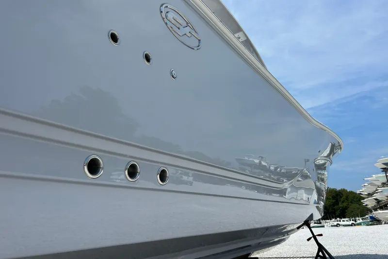 Slide: The Image of 2024 Sea Fox 328 Commander boat hull with sleek design and metallic finish. - 4