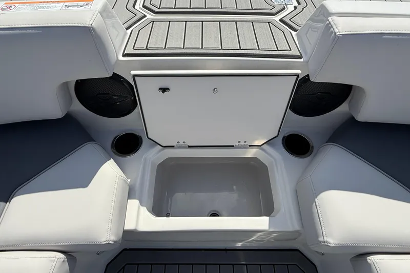 Slide: The Image of Interior of 2026 Starcraft SVX 211 OB boat with seating and storage compartment. - 12