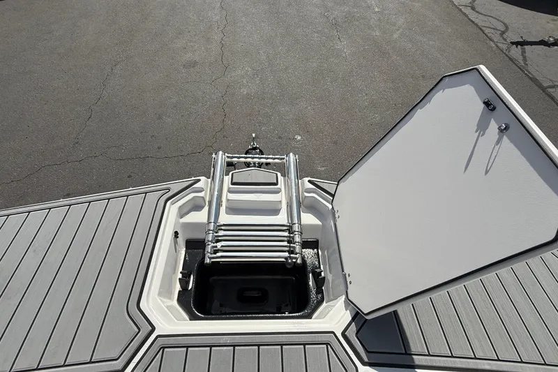 Slide: The Image of Bow view of 2026 Starcraft SVX 211 OB with open hatch and ladder. - 13