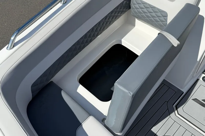 Slide: The Image of 2026 Starcraft SVX 211 OB boat seating with storage compartment, featuring quilted upholstery. - 14