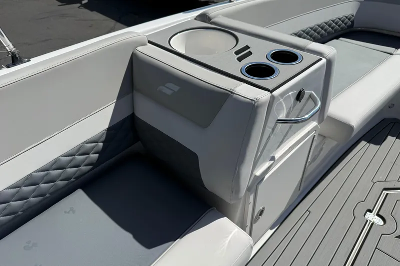 Slide: The Image of 2026 Starcraft SVX 211 OB boat interior with cup holders and quilted seating. - 16