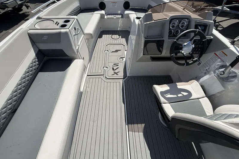 Slide: The Image of Interior of 2026 Starcraft SVX 211 OB boat with modern seating and steering console. - 22