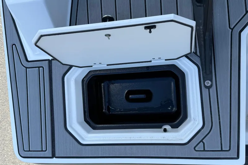 Slide: The Image of Open storage compartment on 2026 Starcraft SVX 211 OB boat deck. - 24
