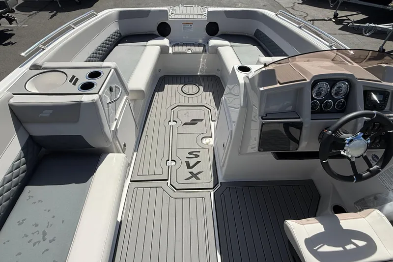 Slide: The Image of Interior view of 2026 Starcraft SVX 211 OB boat, featuring modern seating and dashboard. - 6
