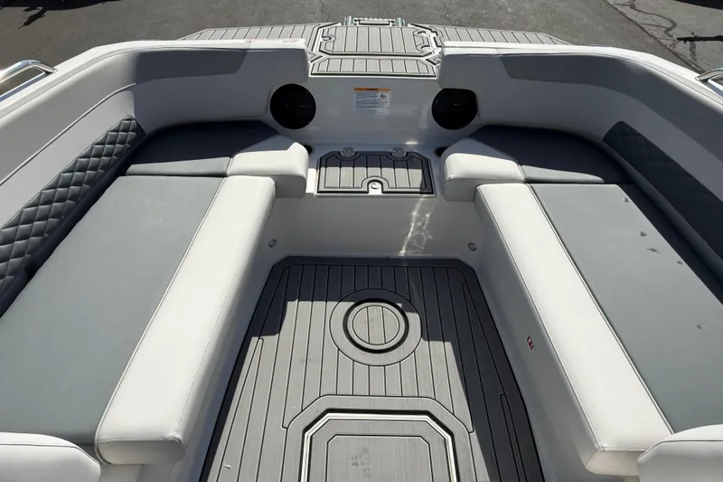 Slide: The Image of 2026 Starcraft SVX 211 OB boat interior with cushioned seating and sleek design. - 8