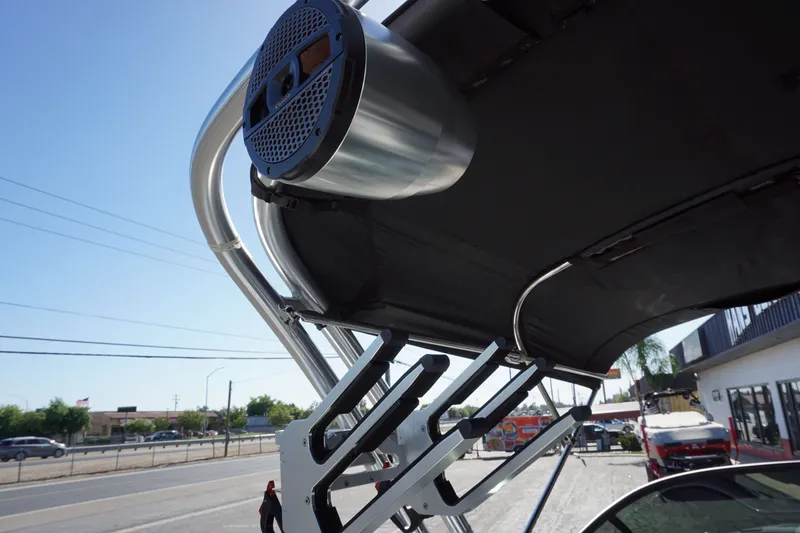 Slide: The Image of 2023 MasterCraft XT22 T boat with speaker and roof rack. - 12