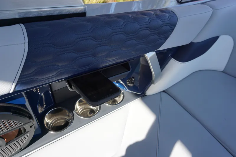 Slide: The Image of Interior of 2023 MasterCraft XT22 T with cup holders and speaker. - 14