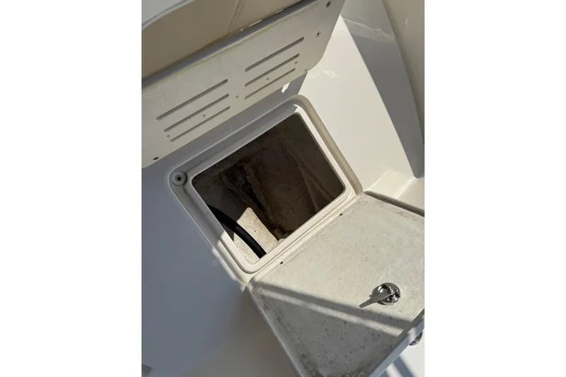 Slide: The Image of Open storage compartment on 2022 Bulls Bay 200 Center Console boat. - 16