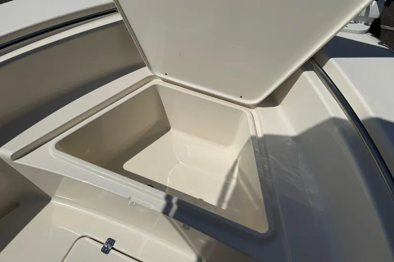 Slide: The Image of Open storage compartment on a 2022 Bulls Bay 200 Center Console boat. - 17