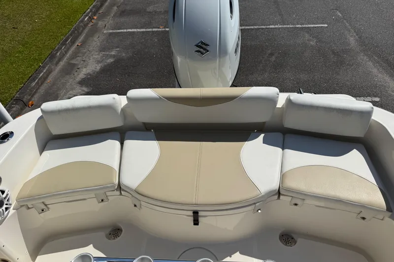 Slide: The Image of 2022 Bulls Bay 200 Center Console boat with cushioned seating and Suzuki engine. - 19