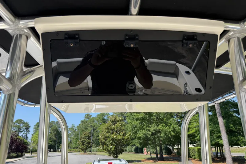 Slide: The Image of 2022 Bulls Bay 200 Center Console boat interior with overhead storage compartment. - 21
