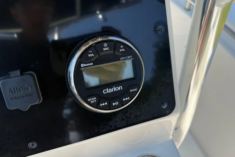 Slide: The Image of Clarion audio system on 2022 Bulls Bay 200 Center Console boat dashboard. - 22
