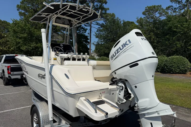 Slide: The Image of 2022 Bulls Bay 200 Center Console boat with Suzuki outboard motor on trailer. - 3