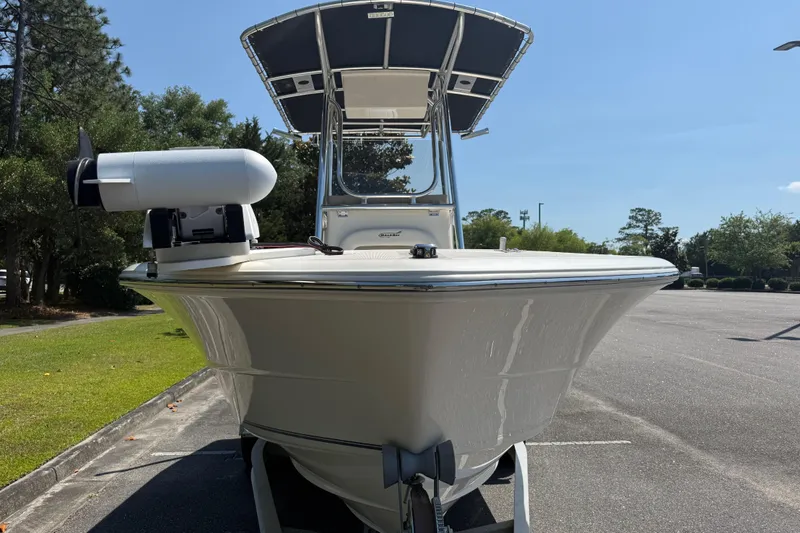 Slide: The Image of 2022 Bulls Bay 200 Center Console boat with T-top in a parking lot. - 9