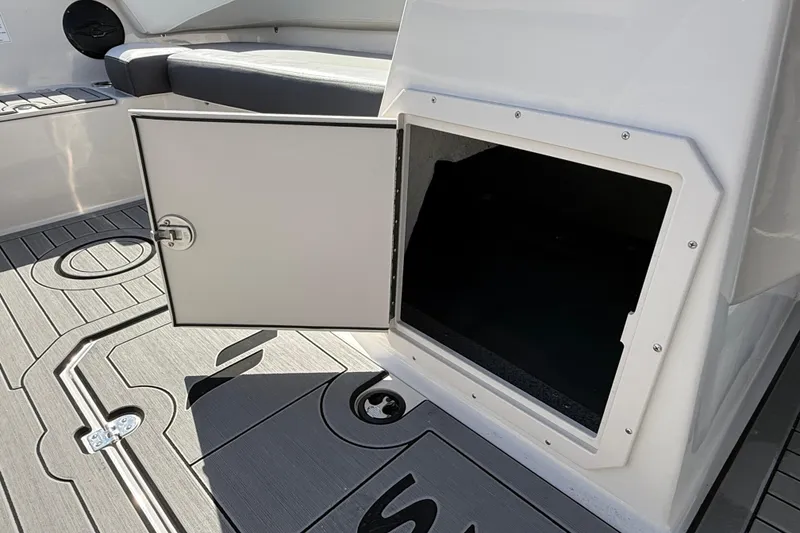 Slide: The Image of Open storage compartment on 2026 Starcraft SVX 191 OB boat deck. - 13