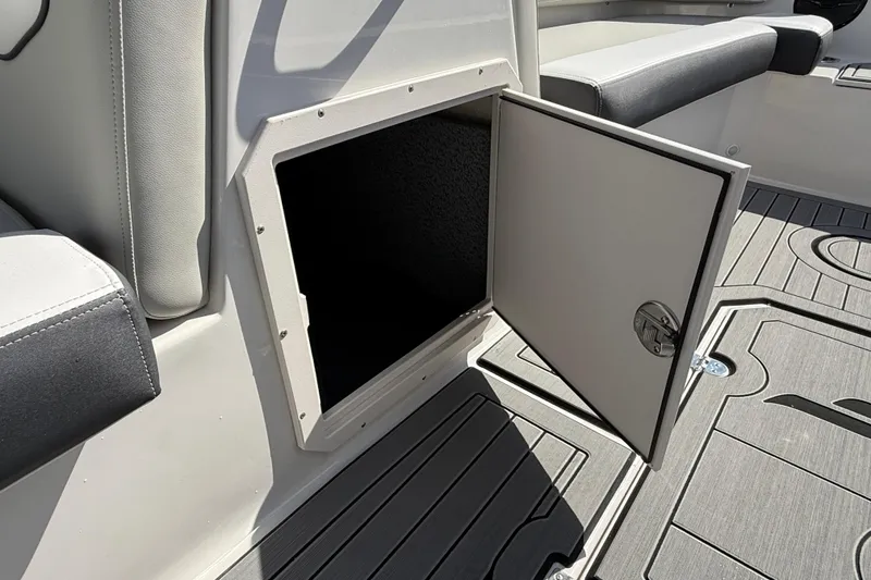 Slide: The Image of Open storage compartment on 2026 Starcraft SVX 191 OB boat, featuring sleek interior design. - 14