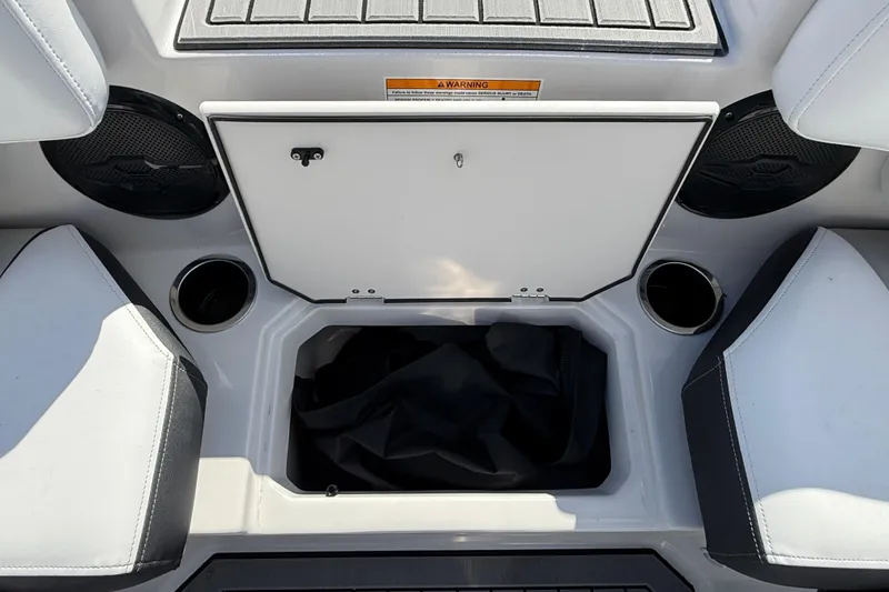Slide: The Image of Interior storage compartment of 2026 Starcraft SVX 191 OB boat with cup holders and speakers. - 15