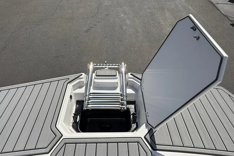 Slide: The Image of 2026 Starcraft SVX 191 OB boat with open hatch and ladder on deck. - 16