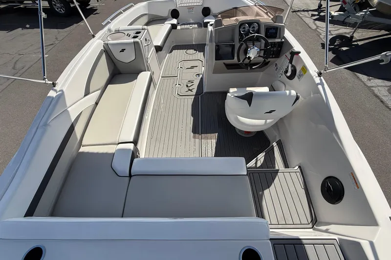 Slide: The Image of 2026 Starcraft SVX 191 OB boat interior with seating, steering console, and modern design. - 5