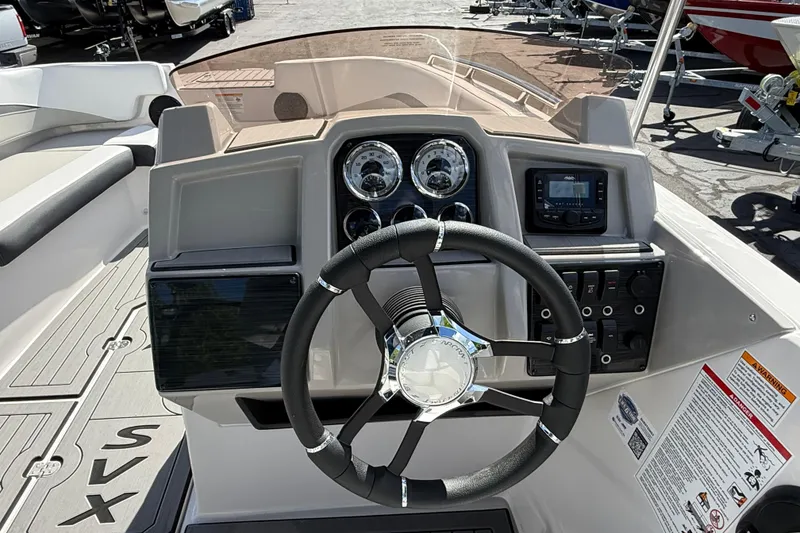 Slide: The Image of Steering console of 2026 Starcraft SVX 191 OB boat with gauges and controls. - 7
