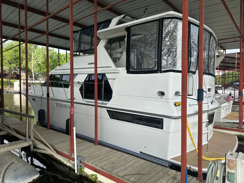 The Image of 1993 Carver Cruiser 440 yacht docked in marina. - 1