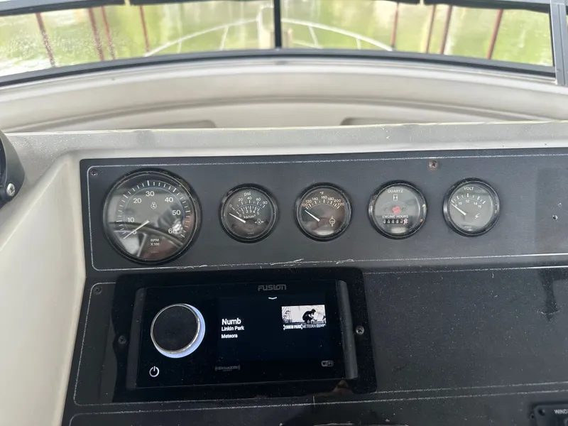 Slide: The Image of 1993 Carver Cruiser 440 dashboard with music display. - 11