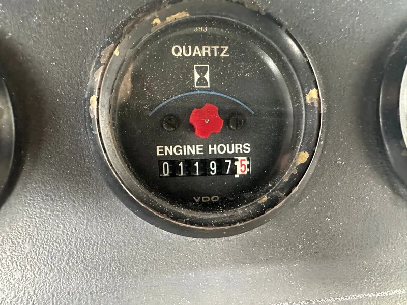 Slide: The Image of 1993 Carver Cruiser 440 engine hour meter displaying 1197.5 hours. - 13
