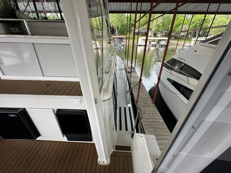 Slide: The Image of 1993 Carver Cruiser 440 docked in covered marina. - 20