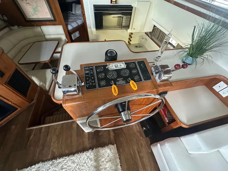 Slide: The Image of Interior view of 1993 Carver Cruiser 440 with helm console. - 24