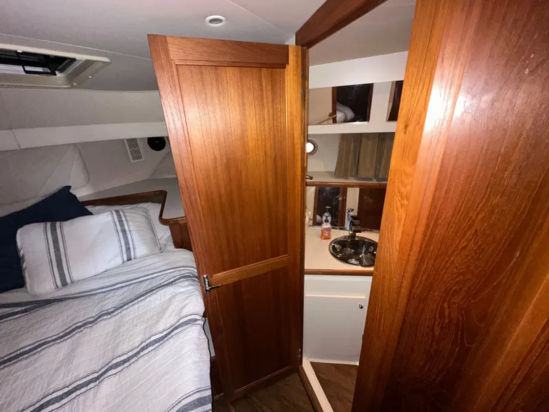 Slide: The Image of Interior of 1993 Carver Cruiser 440 with bed and bathroom. - 33